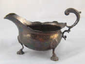 Appraisal: A George II silver sauceboat with leaf capped flying C