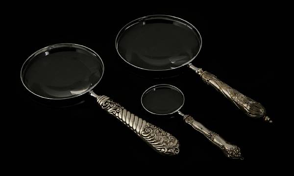 Appraisal: A group of sterling mounted magnifying glasses Comprising Three with