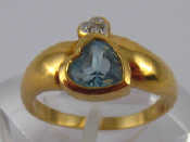 Appraisal: A yellow metal tests carat gold heart shape blue topaz