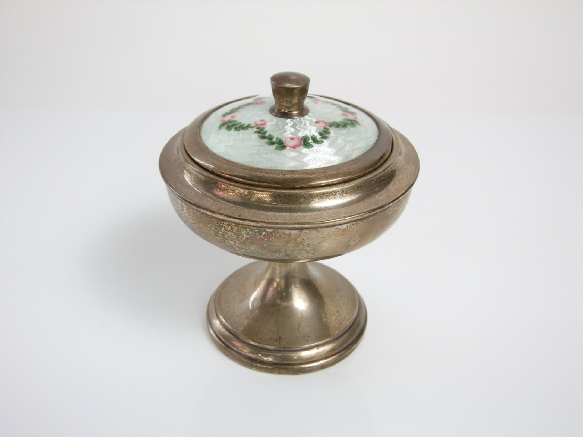 Appraisal: A silver pedestal shaped powder bowl the lid with floral