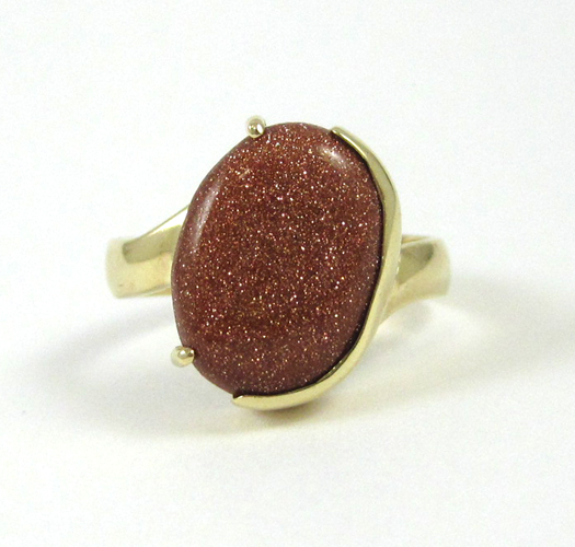 Appraisal: GOLDSTONE AND FOURTEEN KARAT GOLD RING set with a single