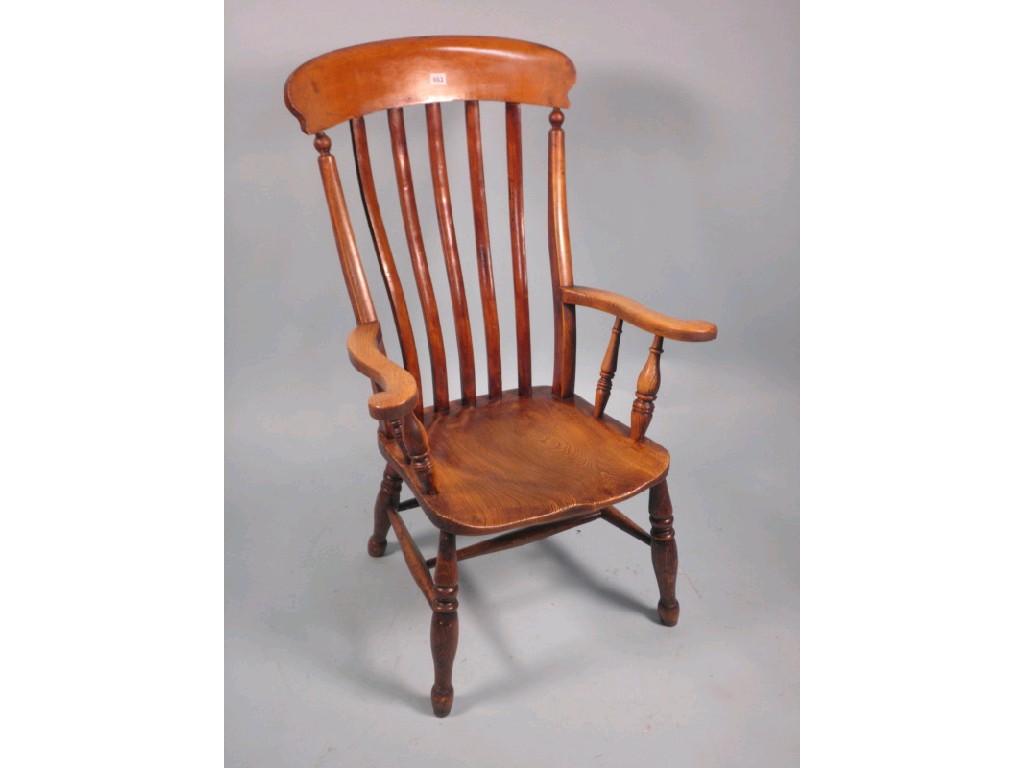 Appraisal: A late thC lathe back Windsor open armchair with a