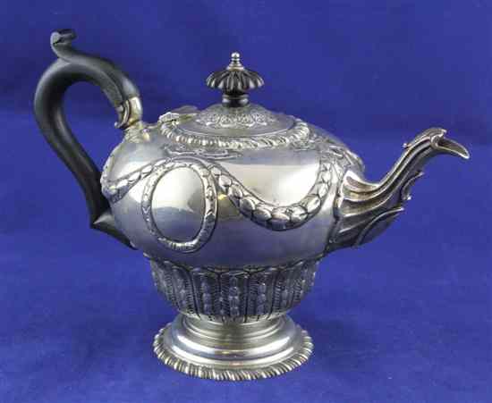 Appraisal: An Edwardian silver teapot of inverted baluster form embossed with