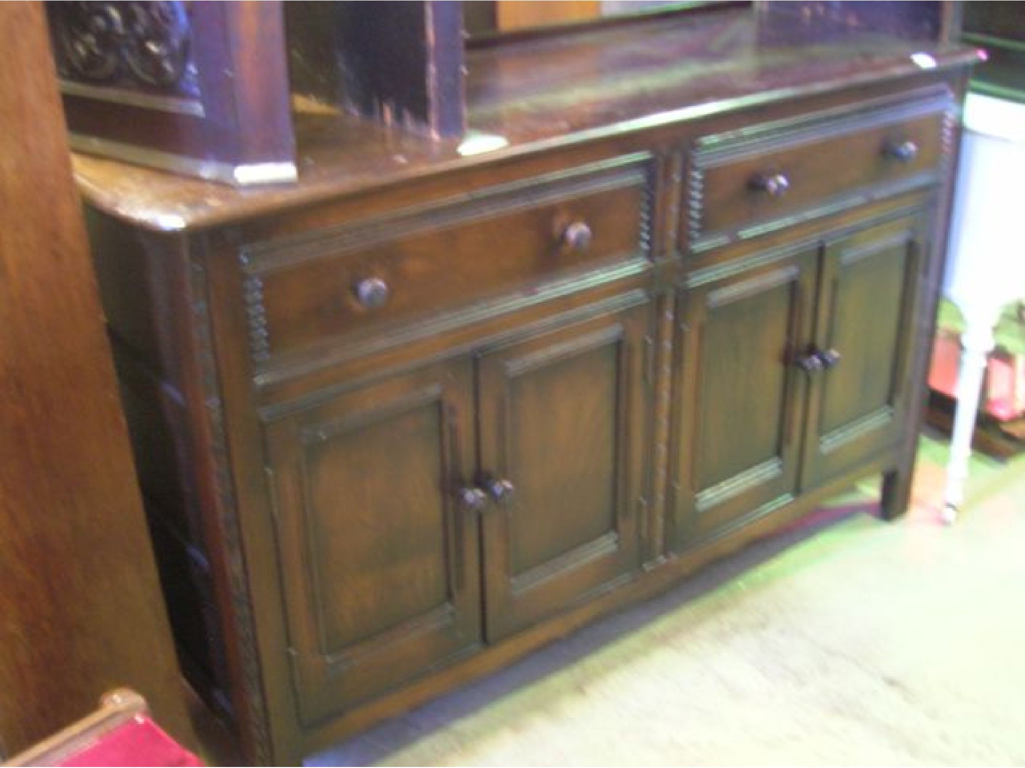 Appraisal: A dark stained elm sideboard probably Ercol enclosed by two