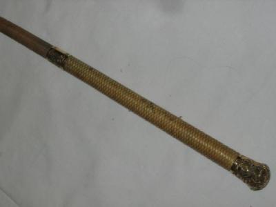 Appraisal: A VICTORIAN RIDING STICK the snakeskin grip with gold finial