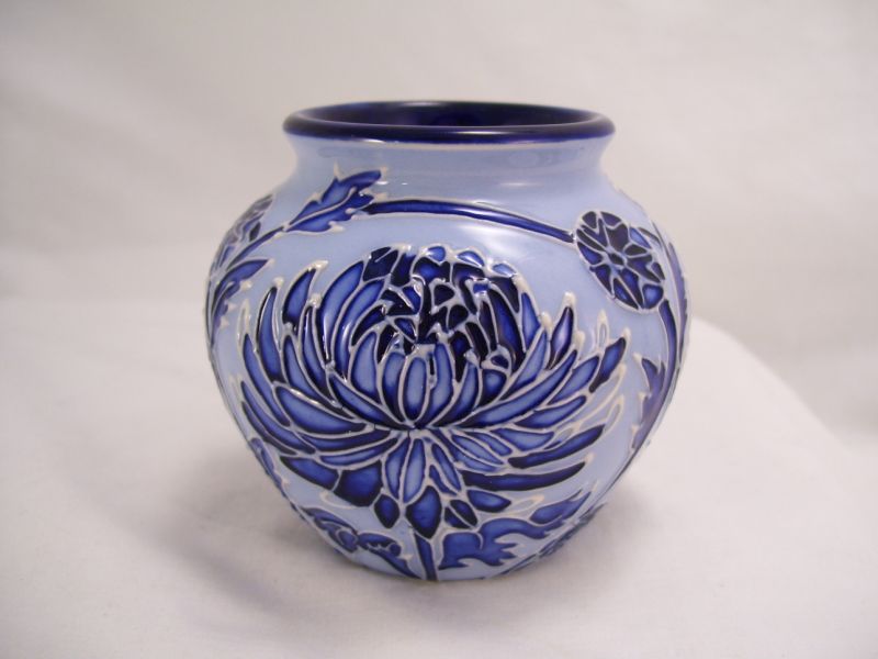 Appraisal: Moorcroft Pottery Vase Light blue on dark blue design with