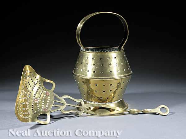 Appraisal: An English Pierced Brass Coal Scuttle and Scoop th c