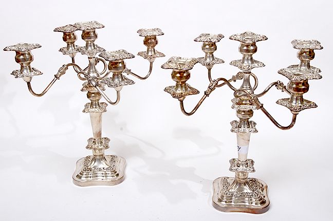 Appraisal: Silver-Plate Candelabra A pair of silver on copper sticks of