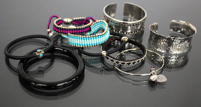 Appraisal: TWO SILVER AND SILK CORD DECORATED BRACELETS by Links a