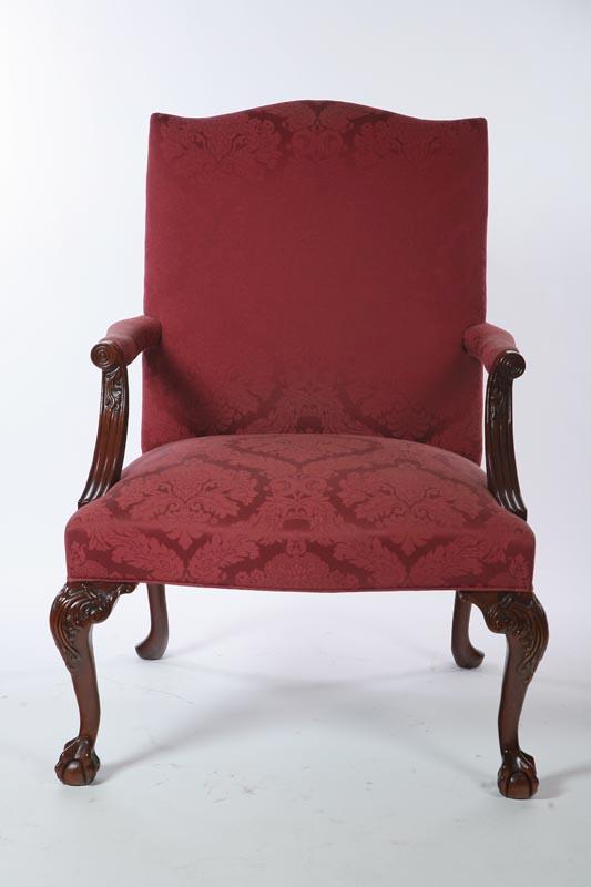 Appraisal: CHIPPENDALE-STYLE ARMCHAIR American th century mahogany Four cabriole legs with