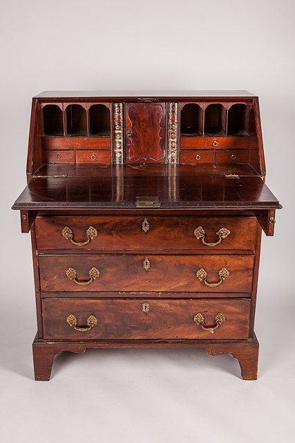 Appraisal: A MAHOGANY GEORGE III BUREAU with fall front over four