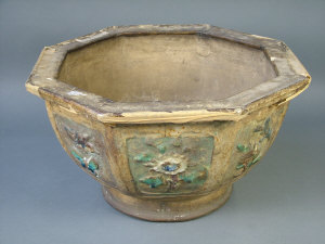 Appraisal: A Chinese glazed pottery octagonal jardiniere with painted panels in