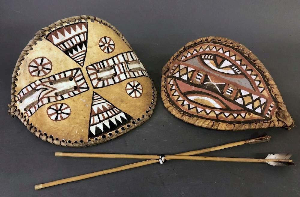 Appraisal: Two Small Masai Shields and Spears Two small Masai shields