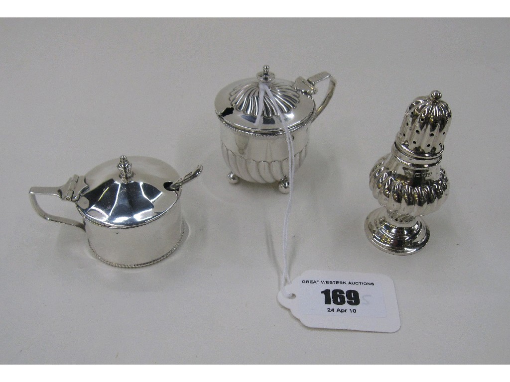 Appraisal: Lot comprising two silver mustard pots and a silver pepperette