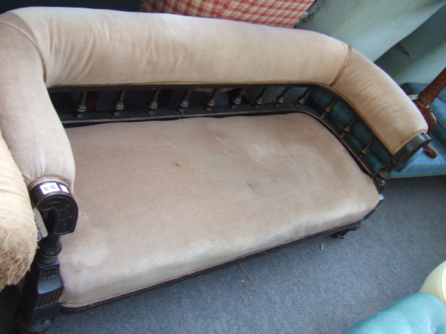 Appraisal: A mid Victorian low back sofa the ebonised and parcel