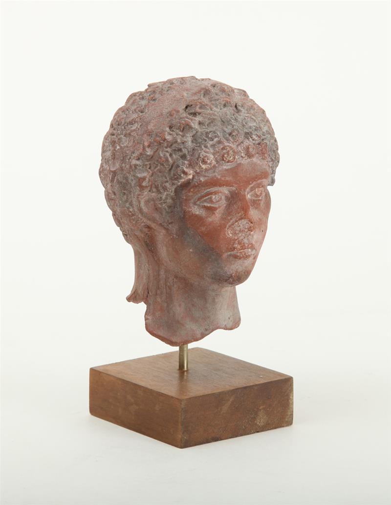 Appraisal: ROMAN TWO-MOLD POTTERY HEAD OF A YOUTH With tightly curled