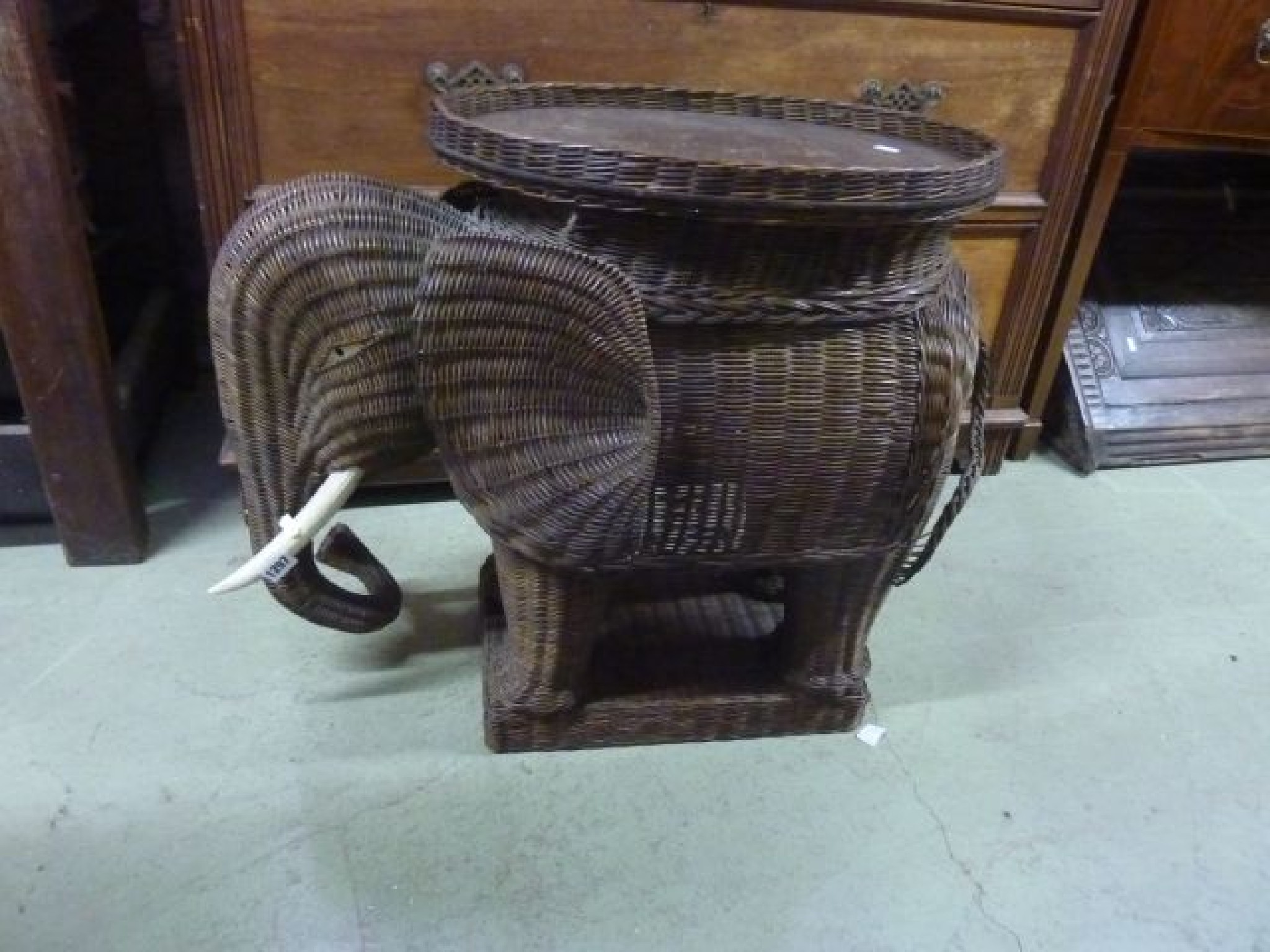 Appraisal: A wicker table with detachable tray in the form of