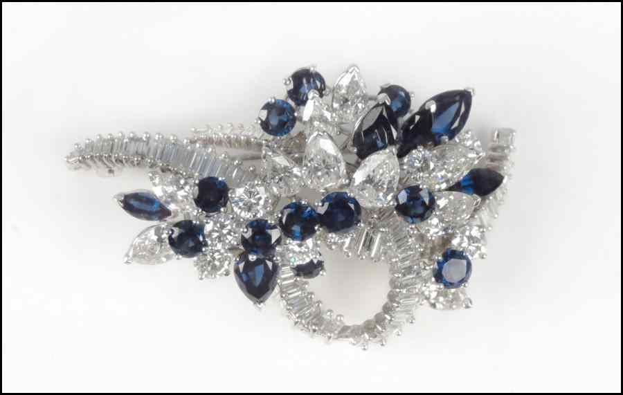 Appraisal: DIAMOND SAPPHIRE AND PLATINUM CLIP BROOCH Diamonds are VVS -