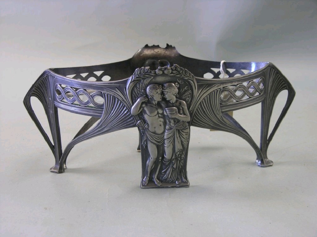 Appraisal: An Art Nouveau pewter centrepiece possibly WMF each centre leg