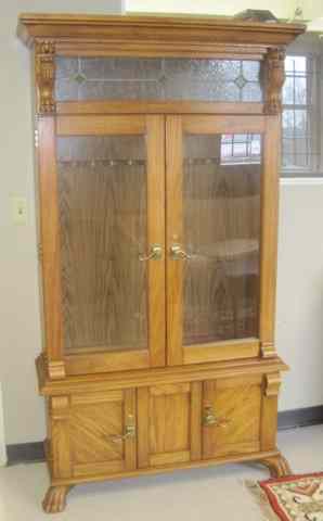 Appraisal: OAK GUN CABINET American antique reproduction the interior accommodating up