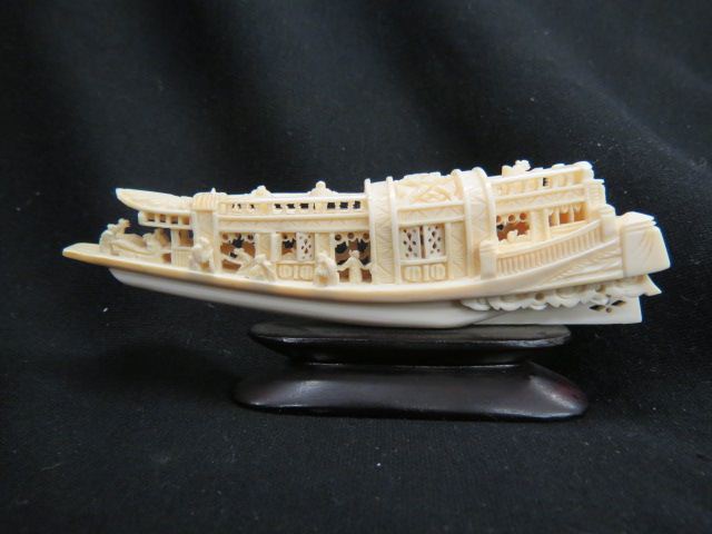 Appraisal: Chinese Carved Ivory of a Ship elaborate long wood base