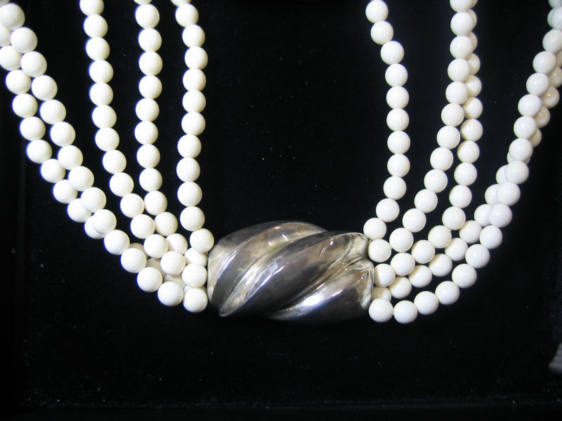 Appraisal: VON MUSULIN IVORY BEAD AND SILVER NECKLACE Four strand mm