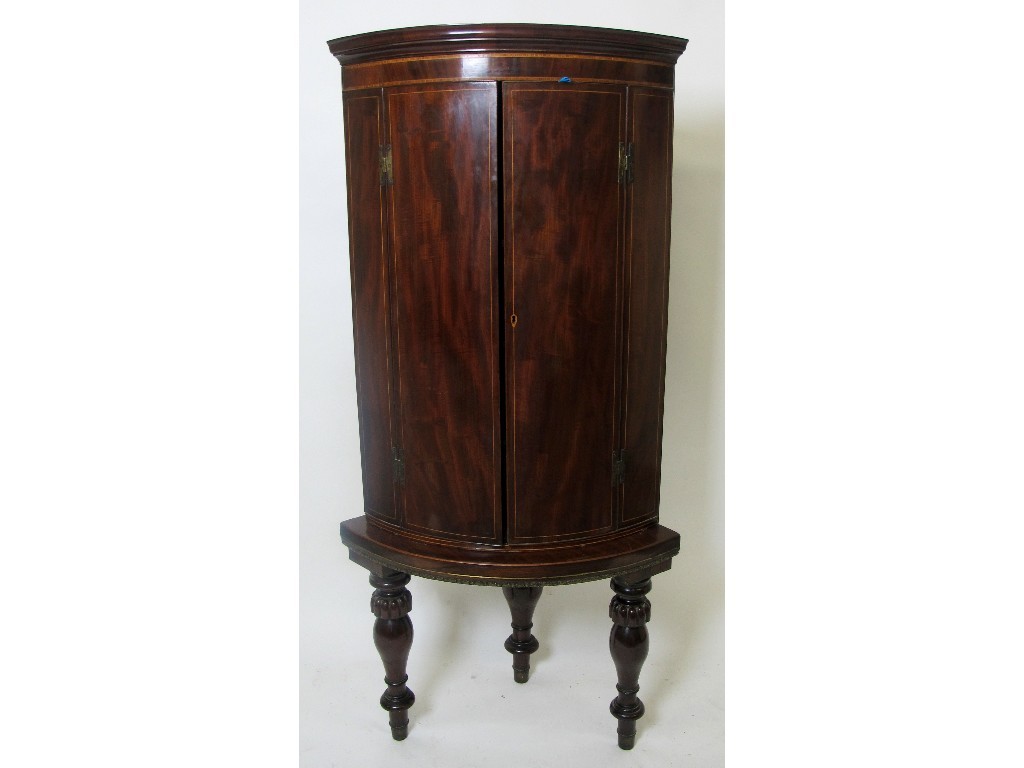 Appraisal: A mahogany inlaid corner cupboard on stand the George III