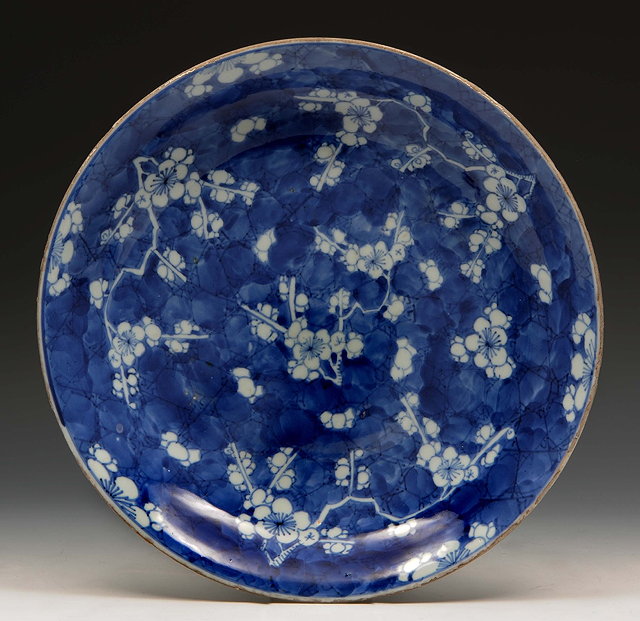 Appraisal: A Chinese blue and white porcelain large shallow dishKangxidecorated plum