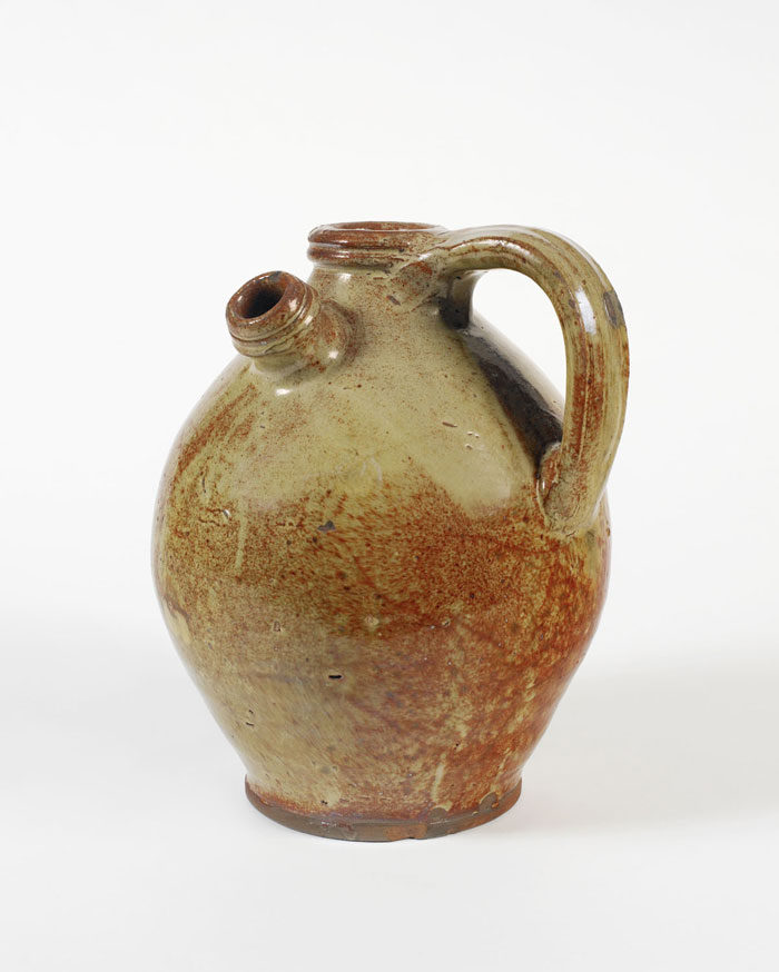 Appraisal: MAINE PALE-GREEN GLAZED REDWARE HARVEST JUG CIRCA With ringed neck