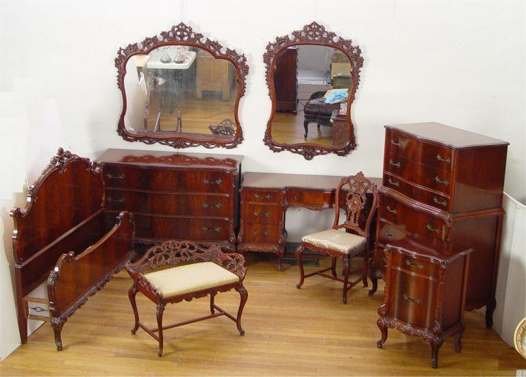 Appraisal: EARLY TH C FRENCH STYLE CARVED BEDROOM SET Richly grained