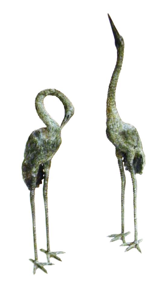 Appraisal: th C cast-metal garden statuary two standing cranes largest crane