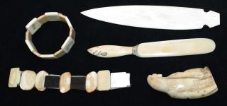 Appraisal: Inuit bone walrus tusk carved pieces including bracelets figure letter