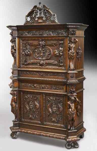 Appraisal: Elaborately carved walnut bureau cabinetwith eagle carved crest over a