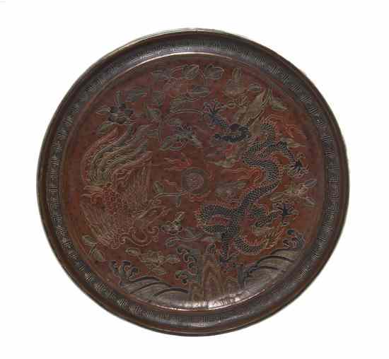 Appraisal: A Chinese Lacquered Bronze Mirror the top having a black