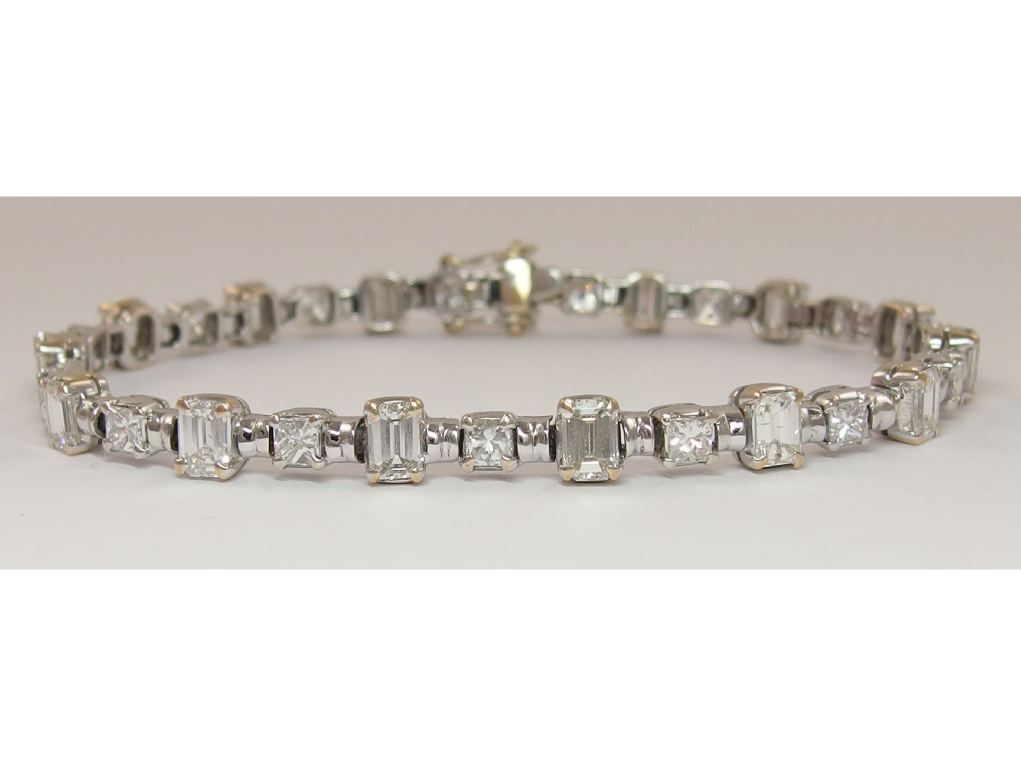 Appraisal: A superb ct diamond line braceletset with alternate emerald cut