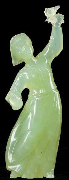 Appraisal: Chinese Cultural Revolution Figurea young woman holding flowers aloft carved