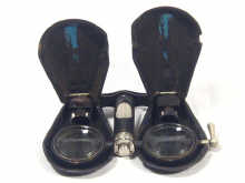 Appraisal: A pair of 's leather covered folding opera glasses