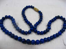 Appraisal: A necklace made up of lapis beads cm long