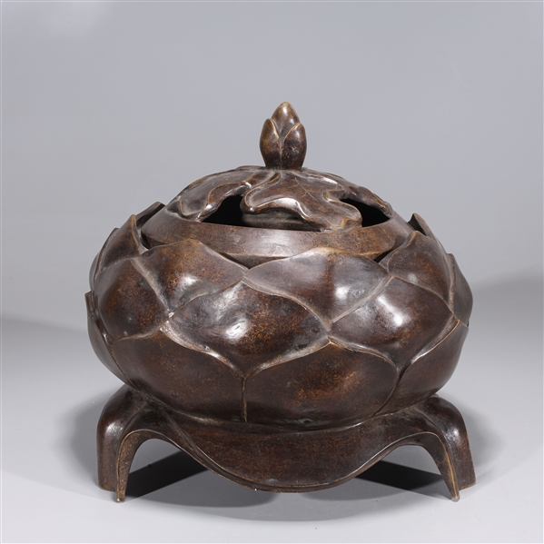 Appraisal: Chinese bronze covered tripod censer with acorn finial and molded