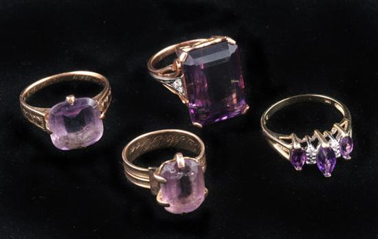 Appraisal: FOUR YELLOW GOLD AND AMETHYST RINGS One with emerald-cut amethyst