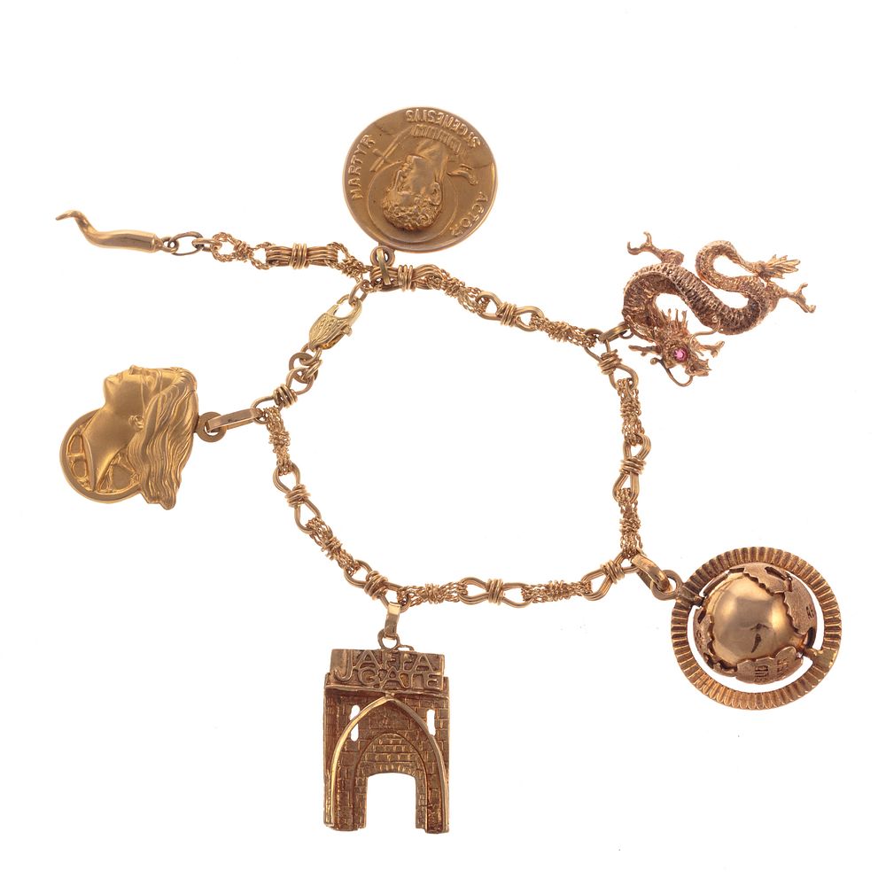 Appraisal: An K Charm Bracelet in Gold with K Charms K