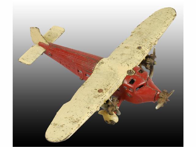 Appraisal: Cast Iron Kilgore Tat Tri-Motor Airplane Toy Description Red fuselage