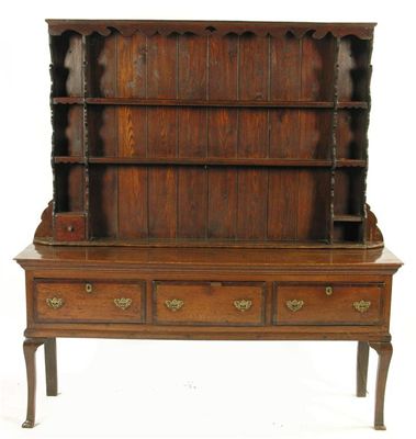 Appraisal: A George III oak dresser the twin planked top above