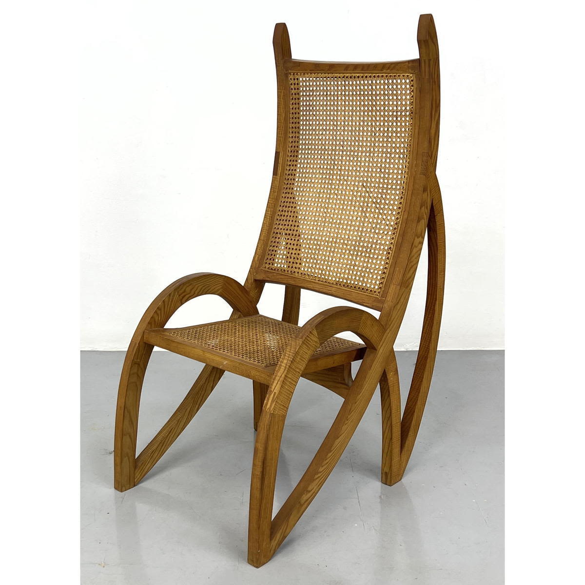 Appraisal: Unusual form Lounge Chair with Caned Seat and Back Looks