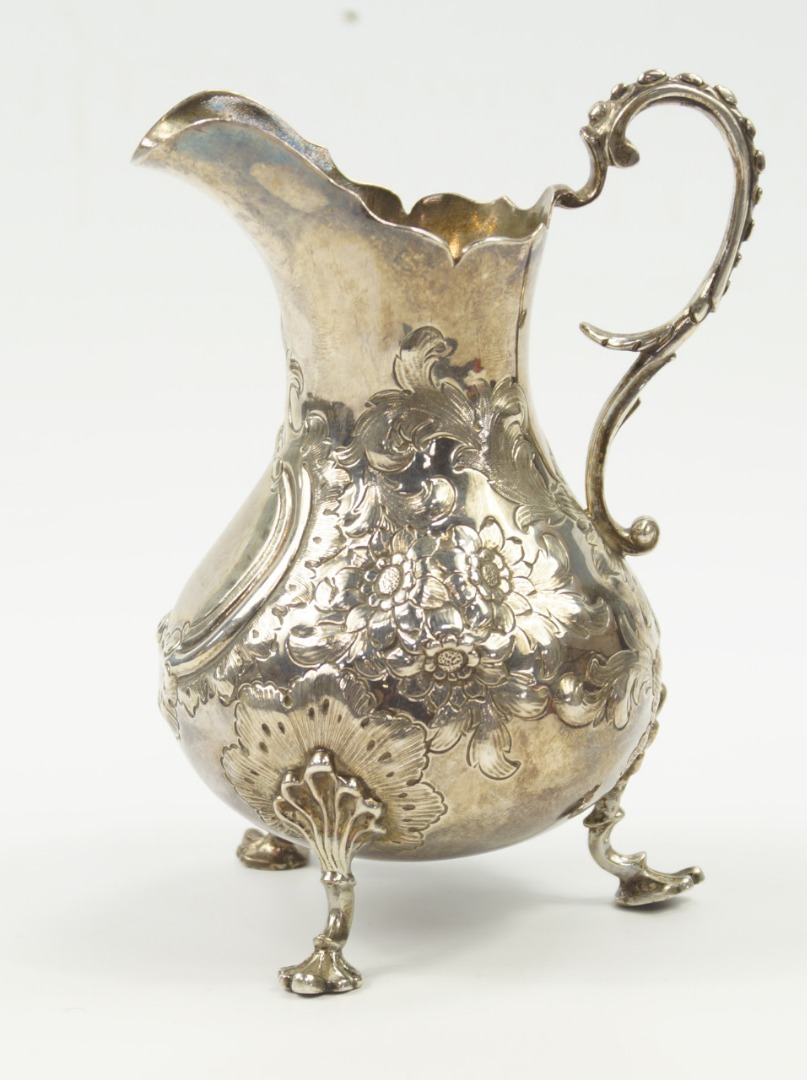 Appraisal: A Victorian silver cream jug of baluster form with embossed