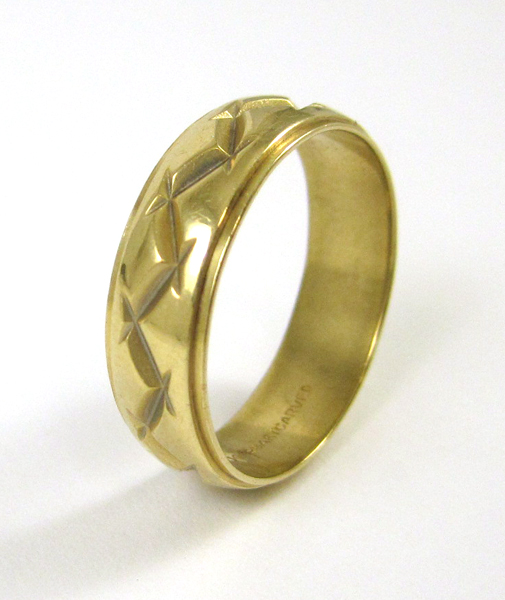 Appraisal: MAN'S ART CARVED FOURTEEN KARAT GOLD BAND measuring mm wide