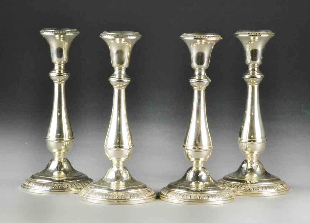 Appraisal: Revere Matching Sterling Silver CandlesticksSet of four weighted sterling silver