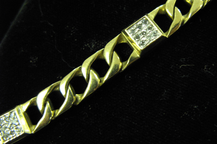 Appraisal: MAN'S DIAMOND AND TEN KARAT GOLD CHAIN BRACELET having four