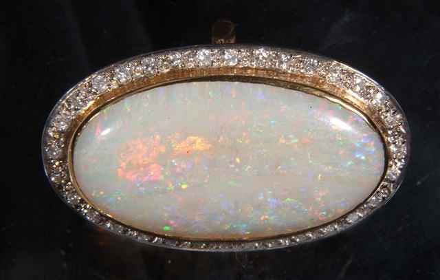 Appraisal: A LARGE OPAL AND DIAMOND SET DRESS RING oval white