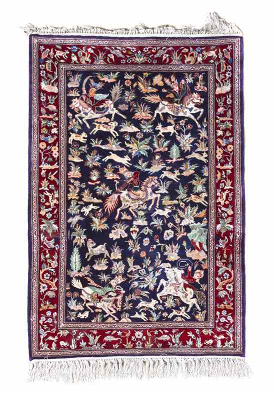 Appraisal: A Persian Silk Rug decorated with hunt scenes depicting figures